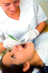 What Is The Dental Hygienist Doing to Your Mouth?