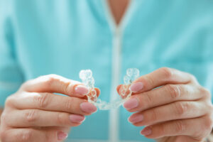 Ask an Orthodontic Dentist: What Do I Do if My Invisalign Retainer No Longer Fits?